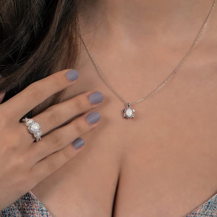 Jewelili Sterling Silver 8X6 MM and 5X3 MM Oval Created Opal and Round Created White Sapphire 3-Stone Engagement Ring